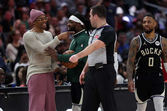 Los Angeles Clippers guard Russell Westbrook (left) talks with Milwaukee Bucks guard Patrick Beverley (21)